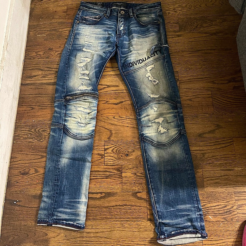 Ripped Jeans with mixed media patches.